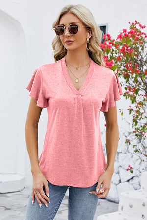 Coral V-neck top with pleated front and flutter sleeves.