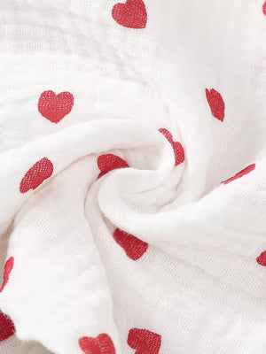White cotton baby outfit with red heart print and headband detail