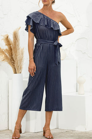 Striped ruffle one-shoulder culotte jumpsuit in dark blue with a belted waist.