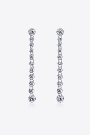 Silver linear drop earrings with multiple moissanite stones cascading down.