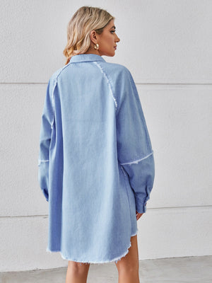 Light blue denim shirt dress with raw hem and button cuffs