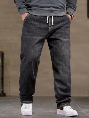 Black 100% cotton jeans with drawstring waist and relaxed fit.