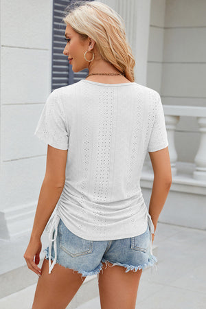 White perforated tee with gathered sides and drawstring detail