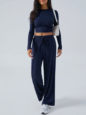 Dark blue ribbed knit crop top and wide leg pants set with drawstring waist.