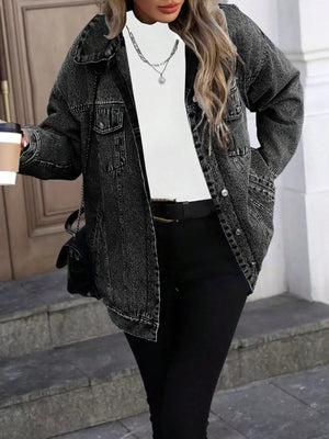 Oversized washed denim jacket in grey with button front and chest pockets.