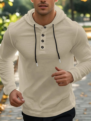 Khaki henley hooded shirt with button placket and drawstring hood.