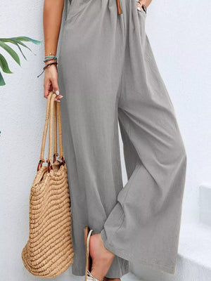 Light gray wide-leg romper with pockets and adjustable drawstring waist