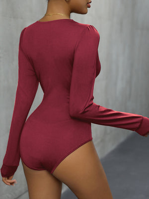 Burgundy long sleeve bodysuit with subtle shoulder ruching.