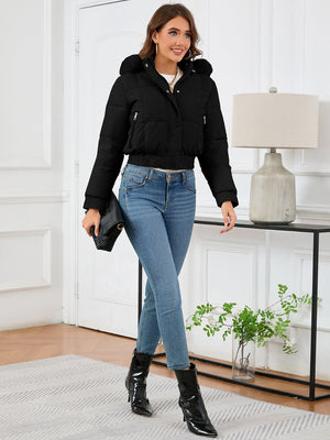 Black puffer jacket with faux fur trim, hood, and elasticated hem.