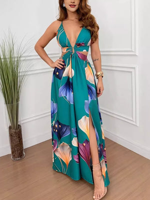 Teal floral maxi dress with plunging neckline, cutout sides, decorative ring, and thigh-high slit.
