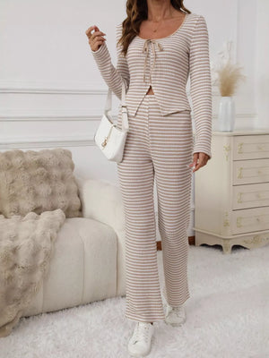 Tied two-piece apricot striped knit set with long sleeves and wide-leg pants.