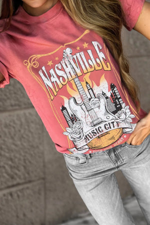 Burnt coral graphic tee with Nashville Music City guitar and city skyline design