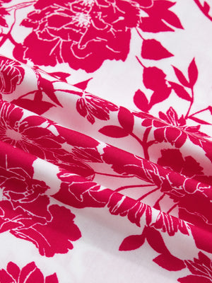 Floral print polyester blouse with lace detail and bright pink flowers on white.