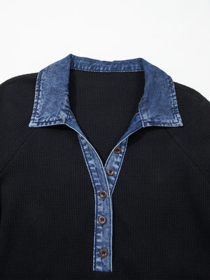 Black textured knit polo top with denim collar and button placket.