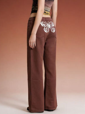 Brown wide-leg jeans with a white butterfly back detail.
