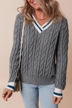 Cable knit sweater in dark gray with v-neck and varsity stripe trim on neckline and cuffs.