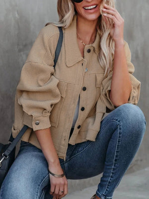 Camel waffle knit cropped utility jacket with button front and chest pockets.
