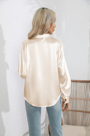 Glossy satin button-down blouse in tan with long sleeves and a relaxed fit.