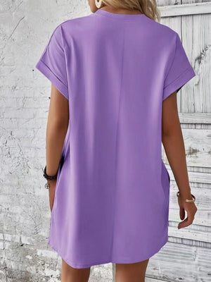 Lavender relaxed tee dress with cuffed sleeves and pockets, casual midi length.