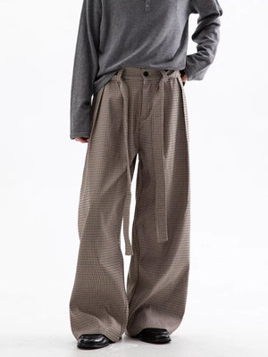 Men's wide leg check trousers in beige and brown with a belted waist.