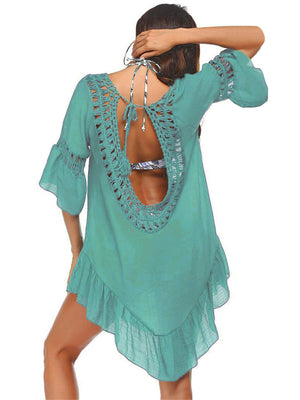 Turquoise cover-up with lace trim, keyhole back, and ruffled hem.