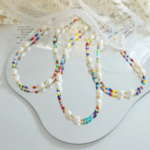 Rainbow bead and baroque pearl choker necklace with gold accents