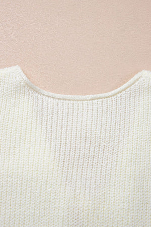 Cream textured knit tank top with a rounded neckline and ribbed detail.