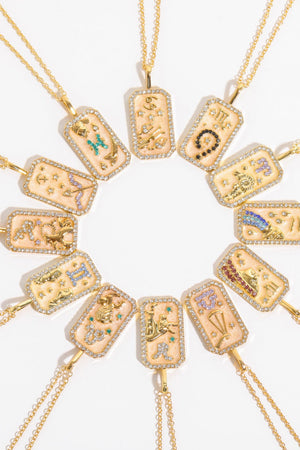 Zodiac sign crystal pendant necklaces in 14K gold-plated metal with gemstone accents.