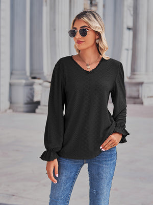 Black lace trim eyelet blouse with v-neck and ruffle cuffs