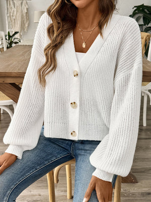 White balloon sleeve button-down knit cardigan with v-neck and cream buttons