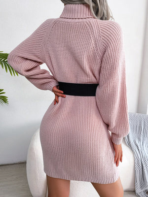 Dusty pink ribbed knit turtleneck sweater dress with balloon sleeves and a black belt.