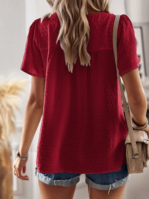 Deep Red textured puff sleeve blouse with a V-neck and short sleeves.