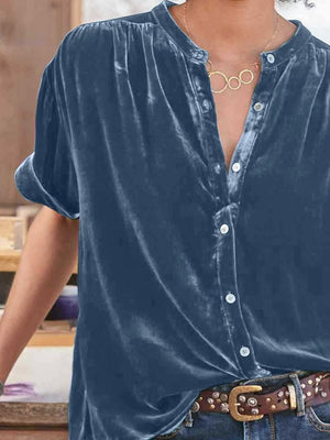 Dusty blue velvet button-down blouse with mandarin collar and short sleeves.