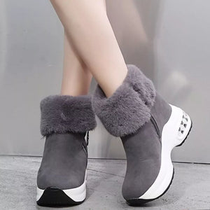 Gray plush ankle boots with side zippers and white air cushion soles.