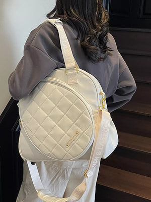 Quilted off-white Oxford bag with adjustable strap for racket storage.