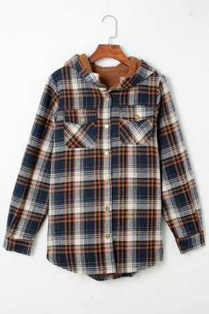 Sherpa-lined plaid overshirt jacket in navy, tan, and cream with button front and chest pockets.