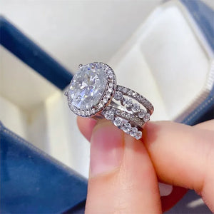Triple band silver ring with oval moissanite halo and sparkling accent stones