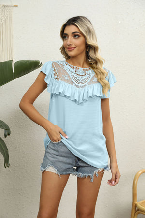 Light blue blouse with lace yoke, ruffle neckline and short sleeves.