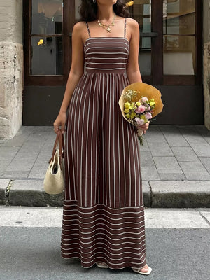 Brown striped maxi dress with smocked detail and cutout.