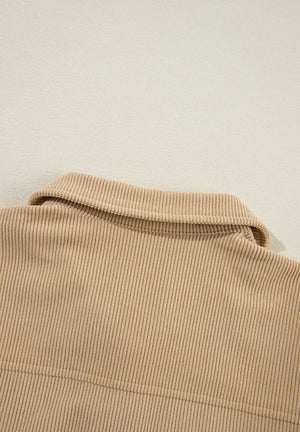 Tan corduroy utility shirt with ruffled pockets, button front, and collar detail.
