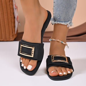 Black buckle decor open toe slide sandals with gold hardware.