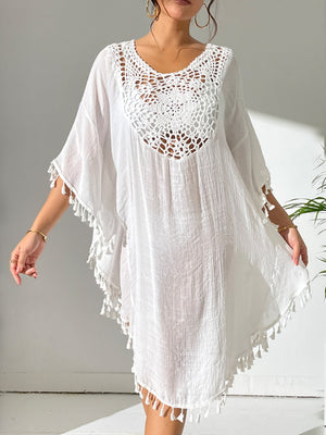 White crochet yoke tassel kaftan dress with short sleeves and a V-neckline.
