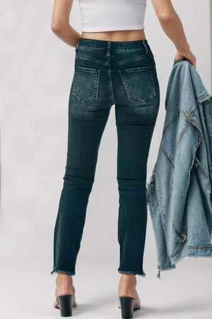 Black high-rise jeans with faded wash and raw hem detail.