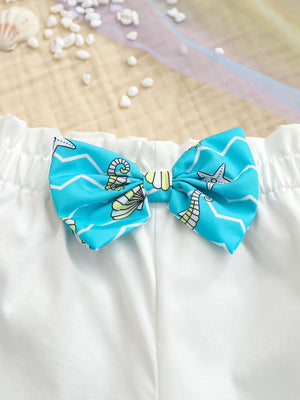 White toddler cami and shorts set with blue seahorse print bow detail