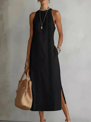 Black sleeveless midi dress with geometric trim and pockets, side slit detail.