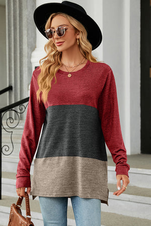 Colorblock long sleeve tee in red, charcoal, and camel with a crew neck and side slits.