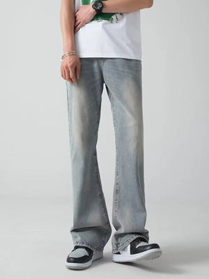 Men's light blue wide-leg jeans with a faded wash and relaxed fit.