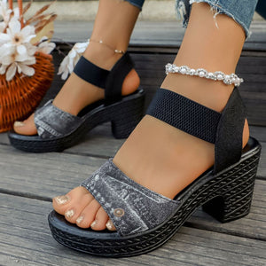Denim-patterned black high block heel sandals with elastic straps.
