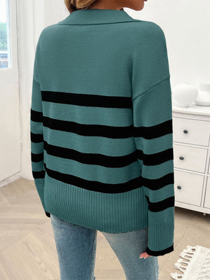 Turquoise knit sweater with bold black stripes and a collar.