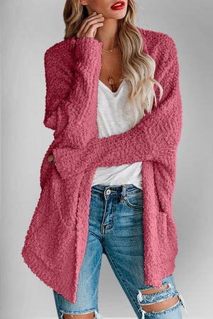 Deep Rose popcorn knit open cardigan with pockets, styled with a white top and distressed jeans.